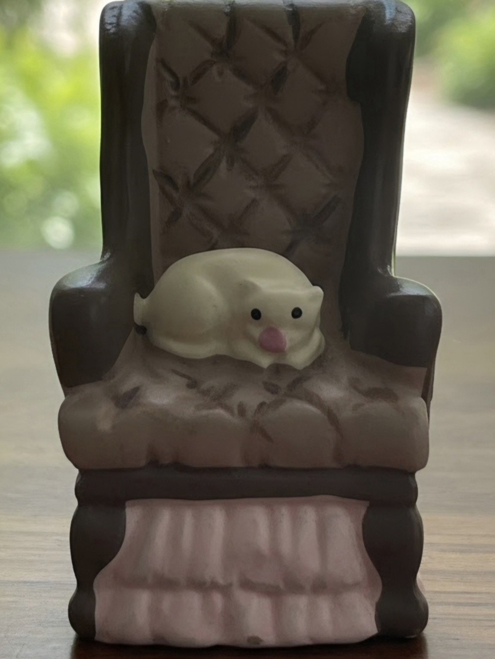 Tiny 2 inch easy chair with a sleeping cat